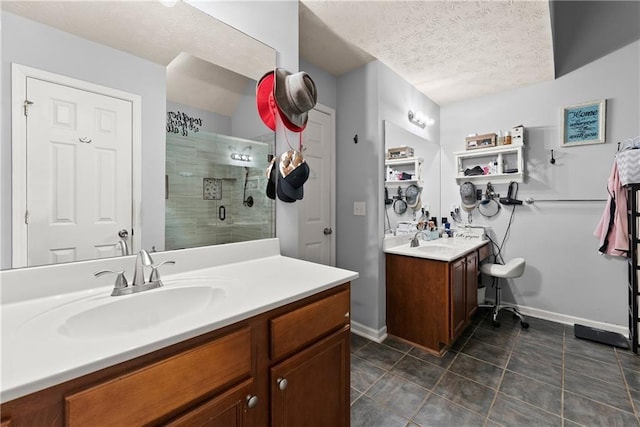 69 Maple Leaf Ct, Hoschton, GA 30548 - full bath with a textured ceiling, a shower stall, vanity, and tile patterned flooring