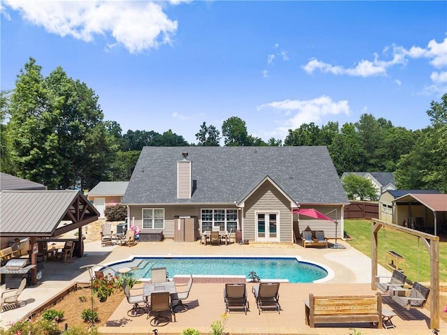 69 Maple Leaf Ct, Hoschton, GA 30548 - outdoor pool featuring outdoor dining space, a patio, and a storage shed