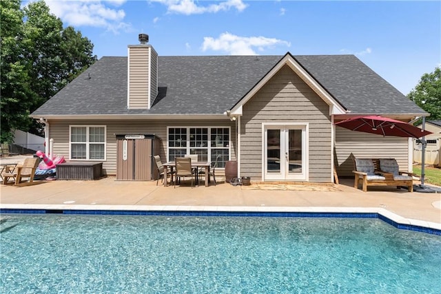 69 Maple Leaf Ct, Hoschton, GA 30548 - rear view of property with a patio, a chimney, french doors, and an outdoor living space
