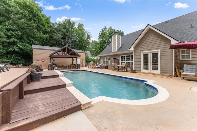 69 Maple Leaf Ct, Hoschton, GA 30548 - outdoor pool featuring a deck, french doors, a patio, and outdoor dining space