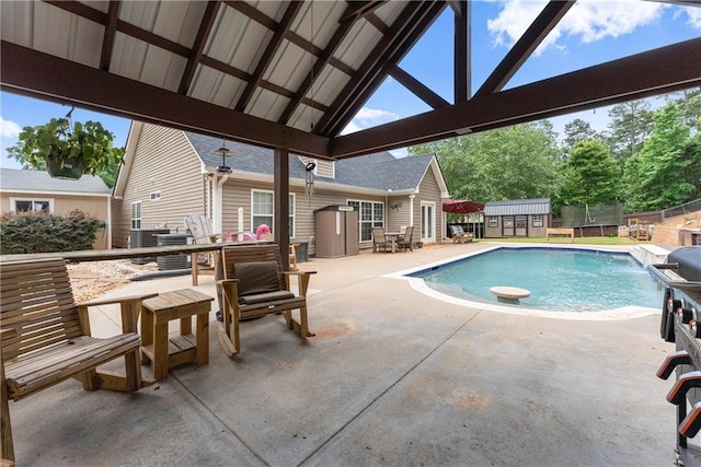 69 Maple Leaf Ct, Hoschton, GA 30548 - view of pool featuring a shed and a patio area