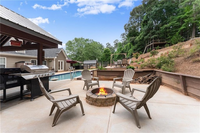 69 Maple Leaf Ct, Hoschton, GA 30548 - view of patio / terrace featuring a fire pit, a grill, an outdoor structure, and a gazebo