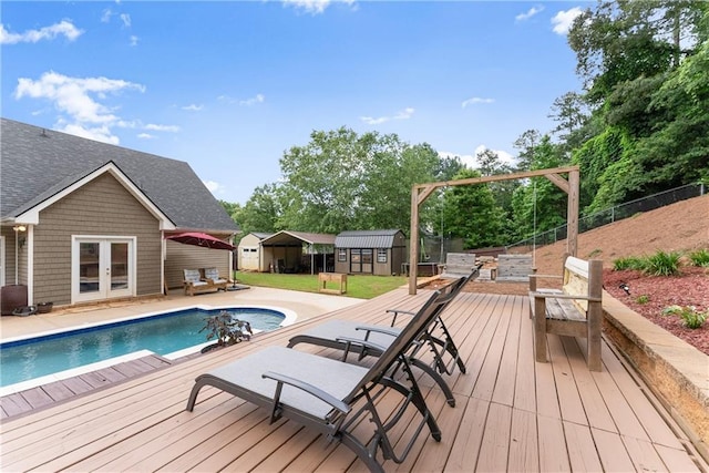 69 Maple Leaf Ct, Hoschton, GA 30548 - view of pool featuring french doors, a deck, a shed, and outdoor lounge area