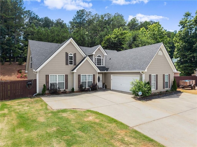 69 Maple Leaf Ct, Hoschton, GA 30548 - view of front of home featuring concrete driveway, an attached garage, and a shingled roof