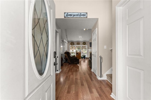 69 Maple Leaf Ct, Hoschton, GA 30548 - entrance foyer with dark wood-style floors and stairs
