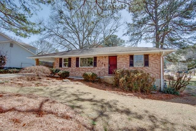 ranch-style home with brick siding