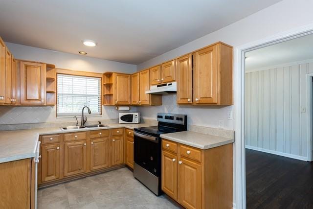 kitchen featuring white microwave, a sink, under cabinet range hood, stainless steel electric range oven, and open shelves