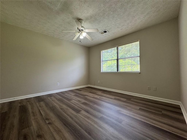 8170 Canyon Forge Dr, Riverdale, GA 30274 - spare room with dark wood-style flooring, a ceiling fan, and a textured ceiling