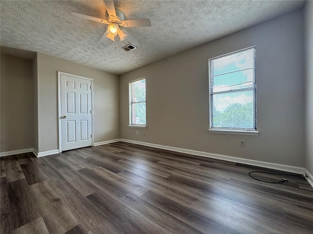 8170 Canyon Forge Dr, Riverdale, GA 30274 - unfurnished bedroom featuring dark wood-style floors, a textured ceiling, and a ceiling fan