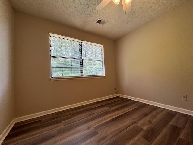 8170 Canyon Forge Dr, Riverdale, GA 30274 - spare room featuring dark wood-type flooring, a textured ceiling, and a ceiling fan
