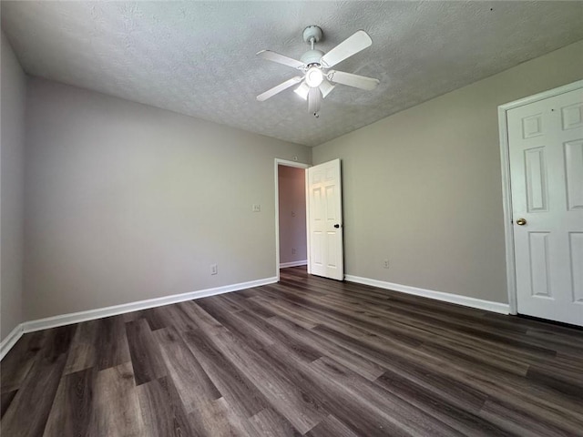 8170 Canyon Forge Dr, Riverdale, GA 30274 - unfurnished bedroom with dark wood-style flooring, a textured ceiling, and ceiling fan