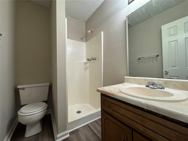 8170 Canyon Forge Dr, Riverdale, GA 30274 - full bathroom featuring a textured ceiling, wood finished floors, vanity, and a walk in shower