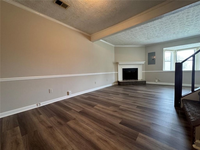 8170 Canyon Forge Dr, Riverdale, GA 30274 - unfurnished living room with a textured ceiling, dark wood-type flooring, a fireplace with raised hearth, crown molding, and electric panel