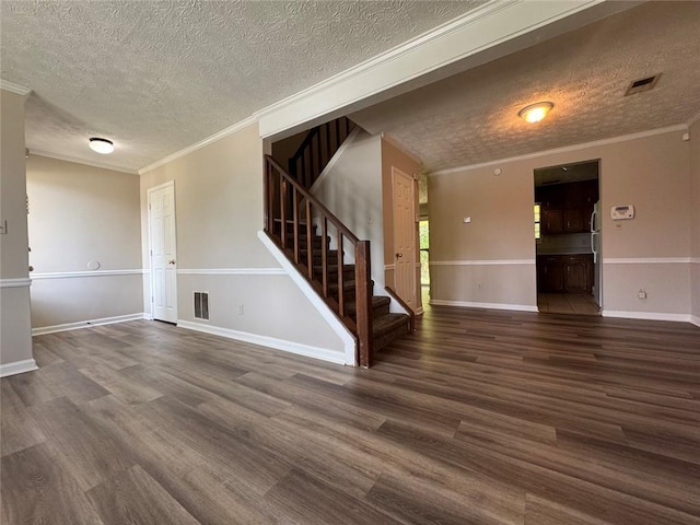 8170 Canyon Forge Dr, Riverdale, GA 30274 - unfurnished living room with a textured ceiling, dark wood finished floors, stairway, and ornamental molding