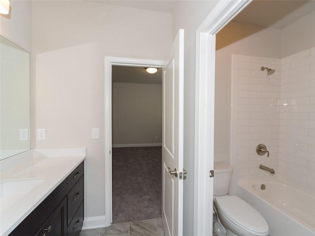 full bath featuring shower / bathing tub combination, vanity, toilet, and baseboards