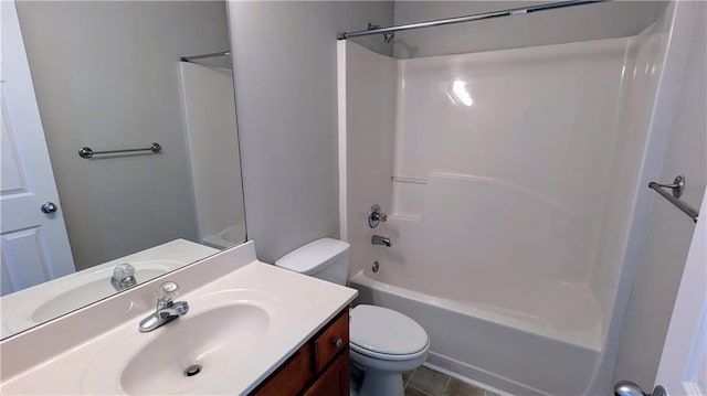 full bath with toilet, vanity, washtub / shower combination, and tile patterned flooring