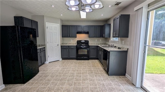 kitchen featuring black appliances, a chandelier, gray cabinetry, light countertops, and a textured ceiling