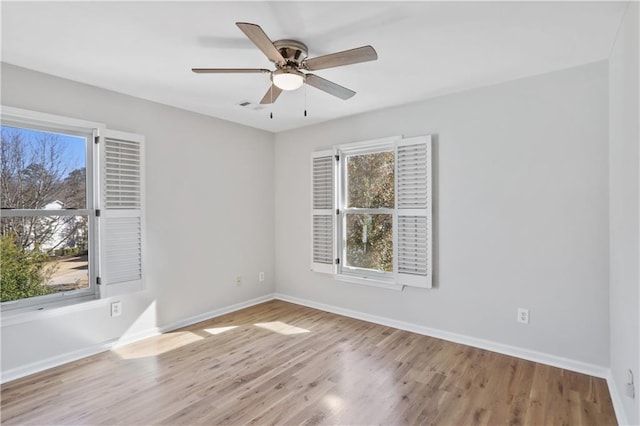 unfurnished room with ceiling fan and light hardwood / wood-style flooring