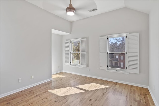 unfurnished room featuring vaulted ceiling, light hardwood / wood-style floors, and ceiling fan