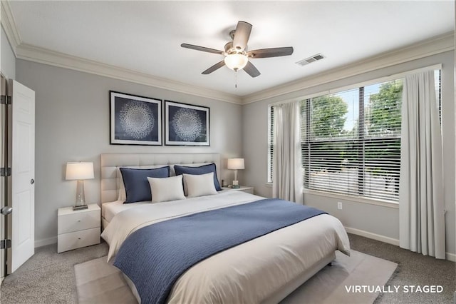 bedroom with ceiling fan, light colored carpet, and ornamental molding