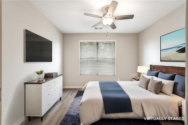 bedroom featuring ceiling fan and light hardwood / wood-style flooring