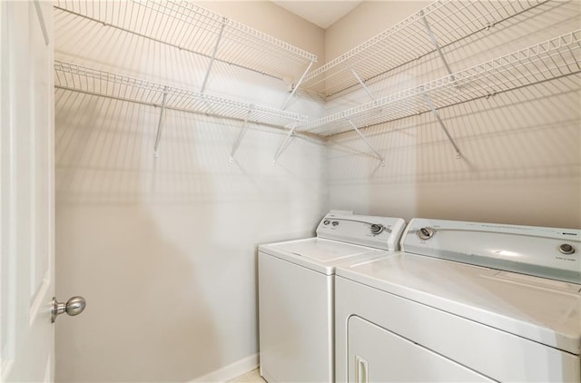 washroom featuring washer and clothes dryer