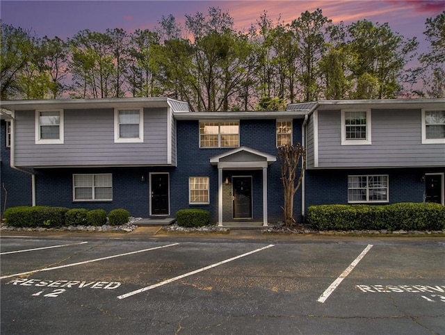 3149 Buford Hwy Unit 3, Brookhaven, GA 30329 - townhome / multi-family property with brick siding and uncovered parking