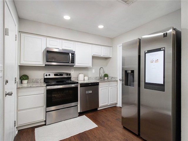 3149 Buford Hwy Unit 3, Brookhaven, GA 30329 - kitchen featuring appliances with stainless steel finishes, dark wood-style floors, white cabinetry, a sink, and recessed lighting