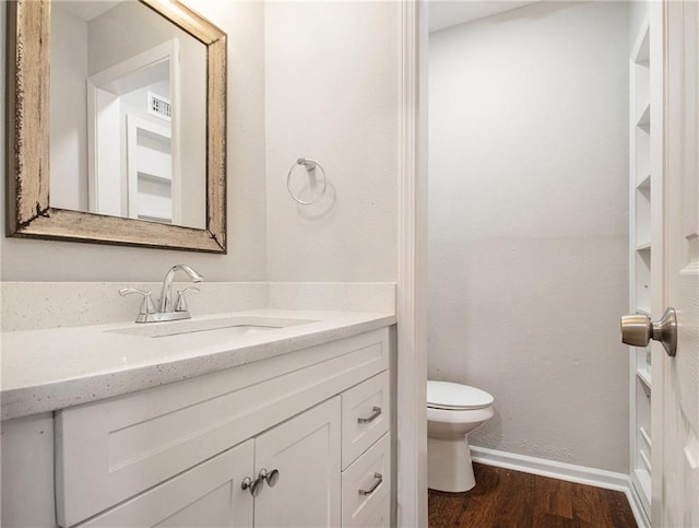3149 Buford Hwy Unit 3, Brookhaven, GA 30329 - bathroom with toilet, vanity, wood finished floors, and baseboards