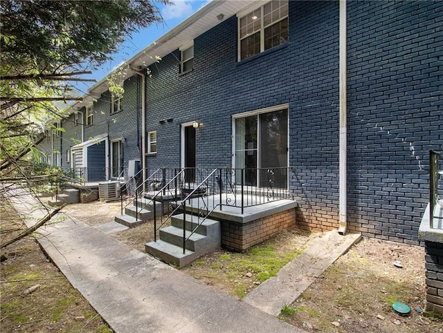 3149 Buford Hwy Unit 3, Brookhaven, GA 30329 - back of house with central AC and brick siding