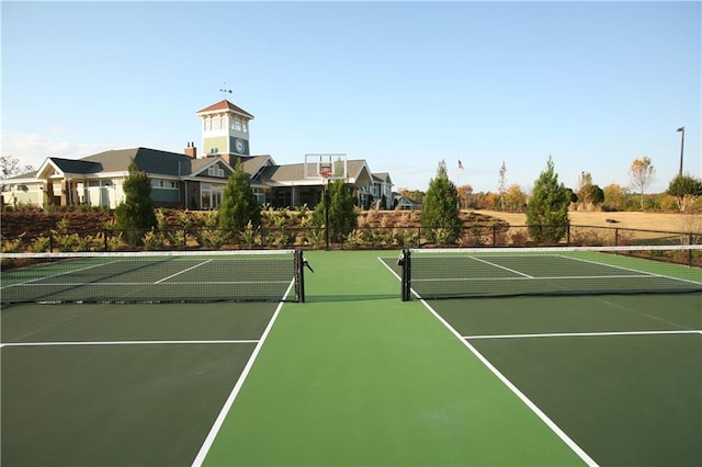 view of sport court with community basketball court and fence