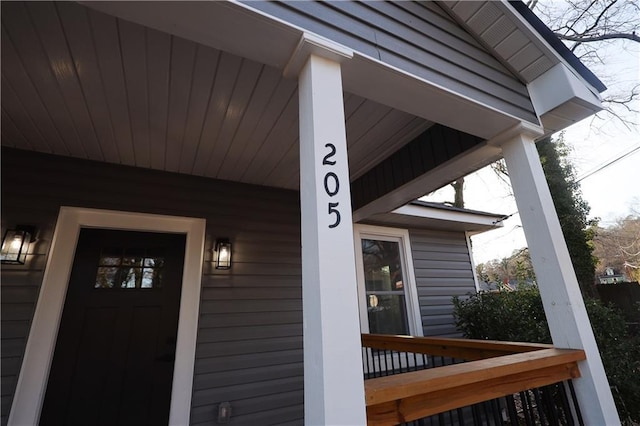 doorway to property with a porch