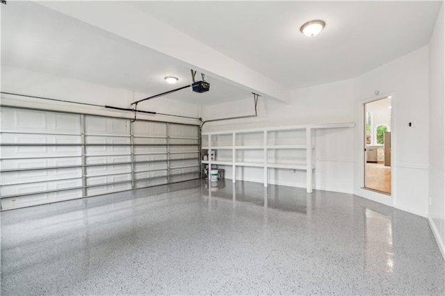 garage featuring baseboards and a garage door opener