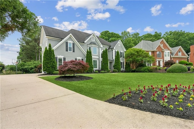 view of front of house featuring a front lawn and stucco siding