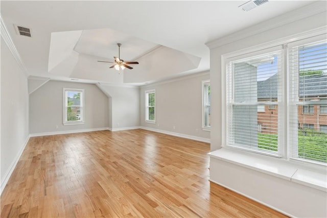 bonus room featuring light wood-style floors, a wealth of natural light, and visible vents