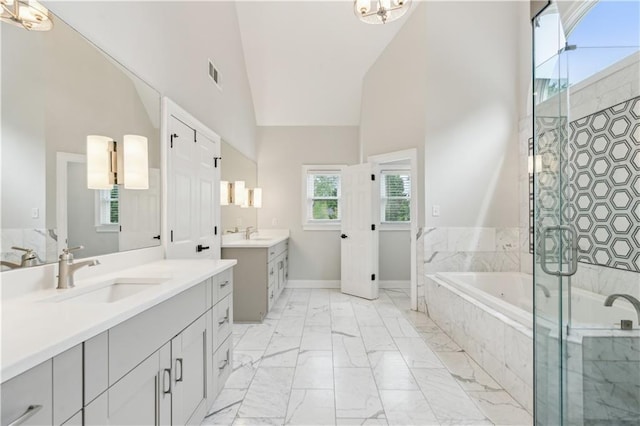bathroom with visible vents, a stall shower, a sink, high vaulted ceiling, and marble finish floor
