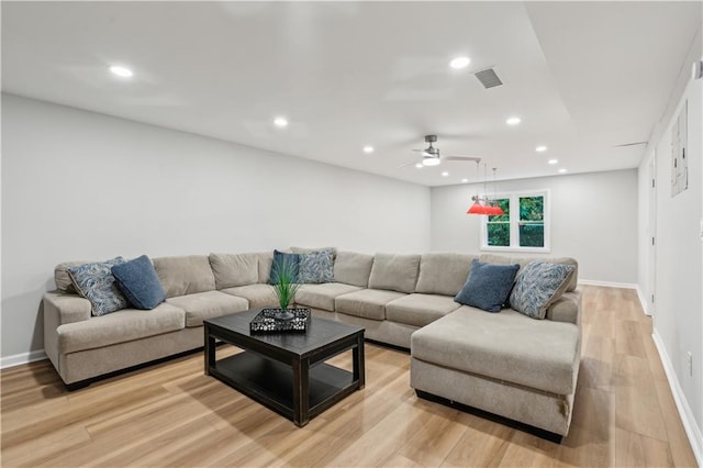 living area with ceiling fan, visible vents, baseboards, light wood-style floors, and recessed lighting