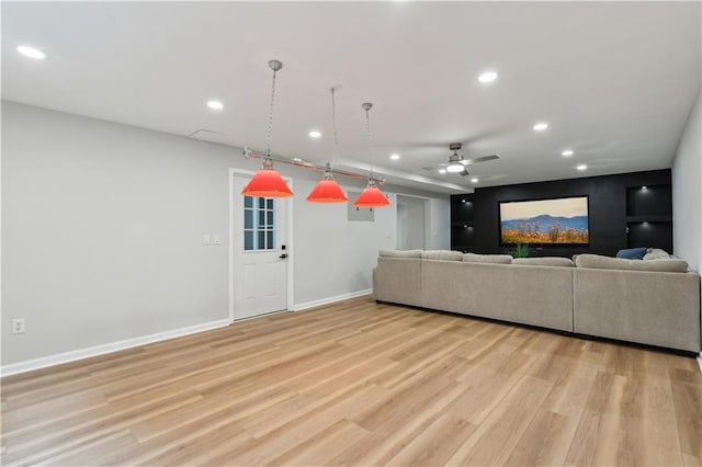 living room with recessed lighting, ceiling fan, baseboards, and light wood-style floors