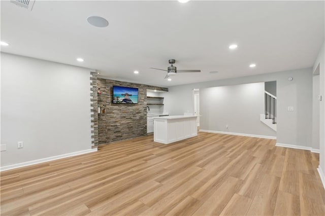unfurnished living room featuring a ceiling fan, visible vents, recessed lighting, and light wood-style floors