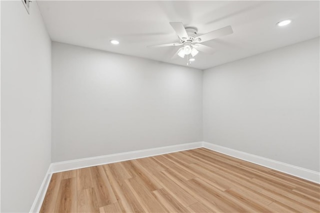 spare room with baseboards, ceiling fan, recessed lighting, and light wood-style flooring