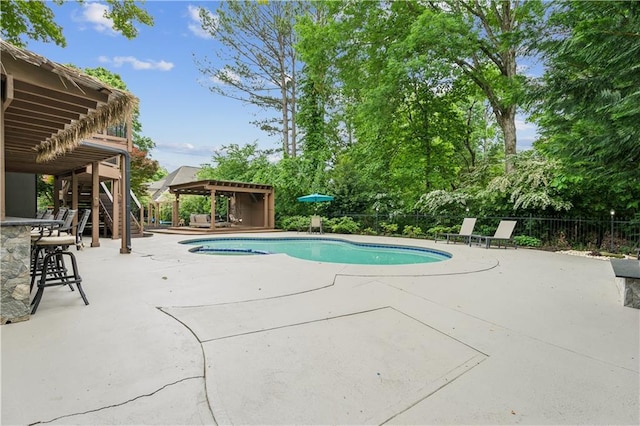 view of pool featuring stairs, fence, a fenced in pool, and a patio