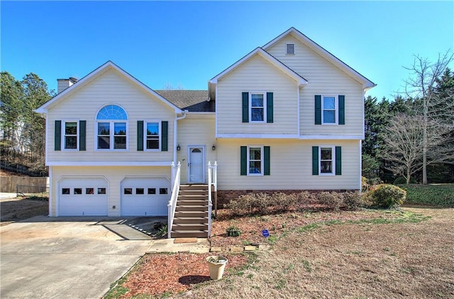 view of front of home with a garage and concrete driveway