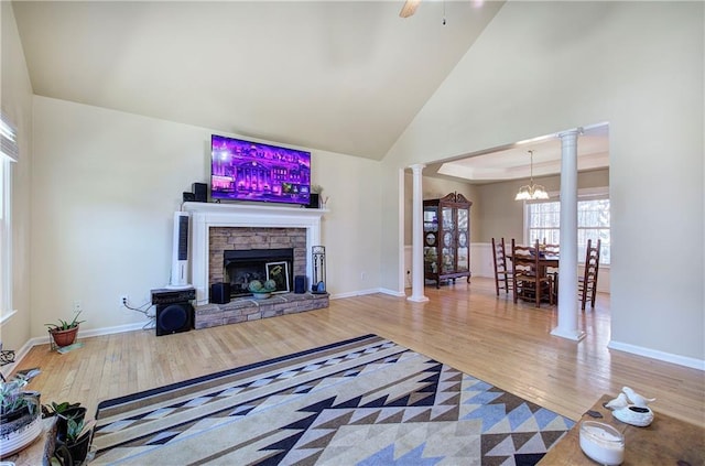 108 Arbor Hills Trl, Talking Rock, GA 30175 - living area with high vaulted ceiling, a fireplace, wood finished floors, baseboards, and ornate columns
