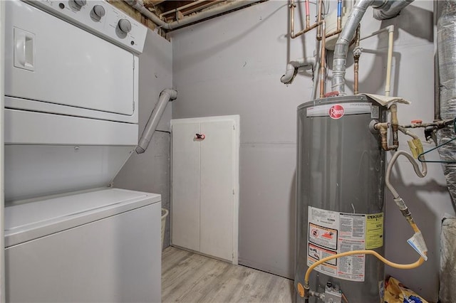 108 Arbor Hills Trl, Talking Rock, GA 30175 - laundry room with stacked washer / dryer, gas water heater, light wood finished floors, and laundry area