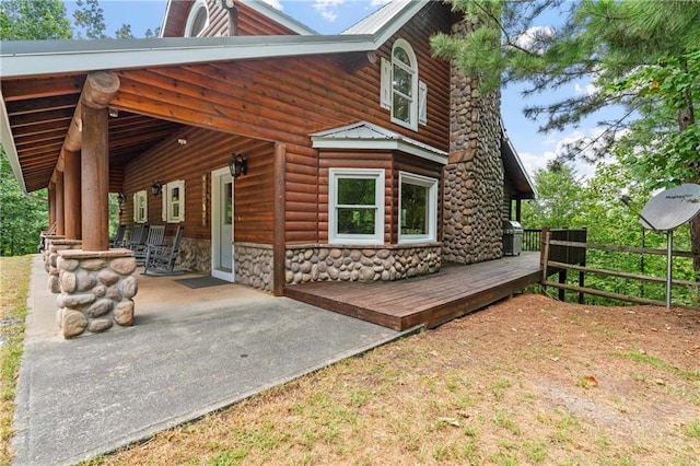 rear view of house with covered porch