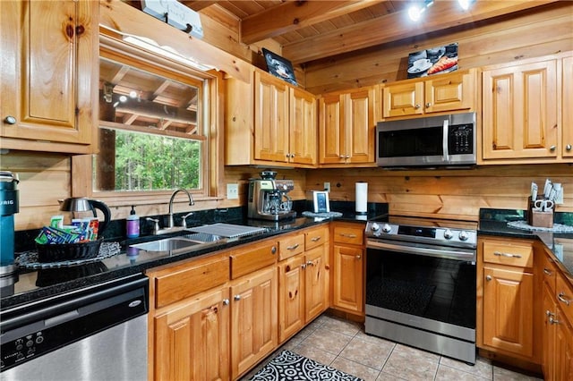 kitchen with beam ceiling, sink, wooden ceiling, light tile patterned floors, and appliances with stainless steel finishes