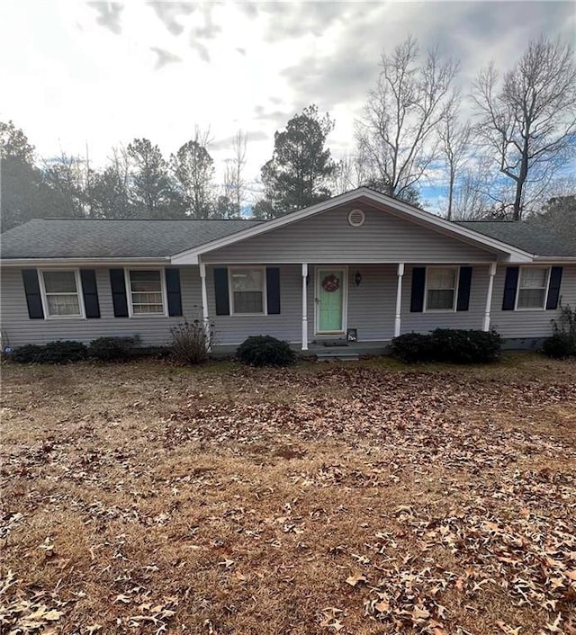 single story home featuring covered porch