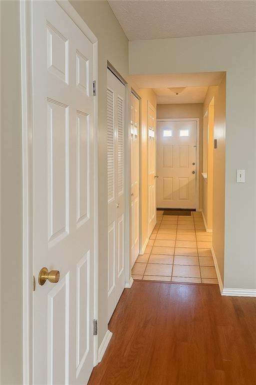 5581 Marbut Rd, Lithonia, GA 30058 - hallway with wood finished floors and baseboards