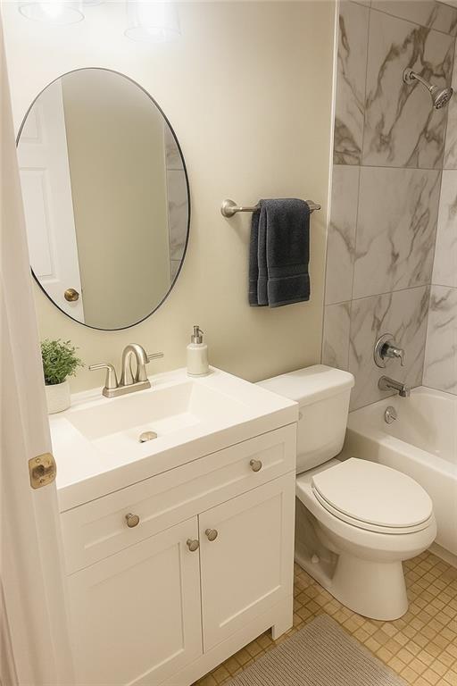 5581 Marbut Rd, Lithonia, GA 30058 - bathroom featuring vanity,  shower combination, and tile patterned floors