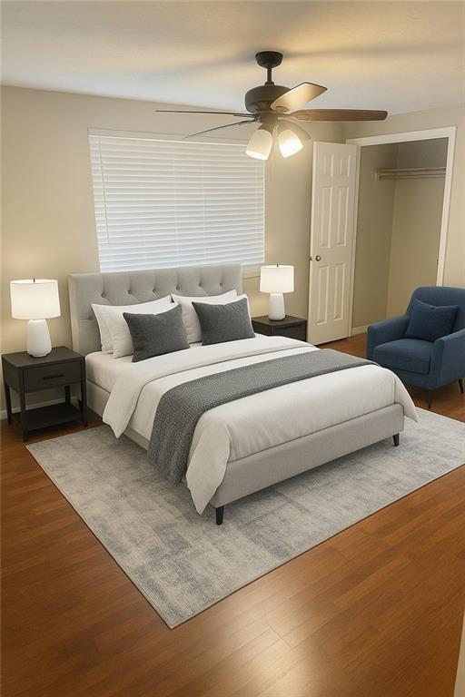 5581 Marbut Rd, Lithonia, GA 30058 - bedroom with wood finished floors and a ceiling fan
